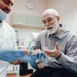 Patient discussing Dental Implants in Foggy Bottom for Permanent Tooth Replacement